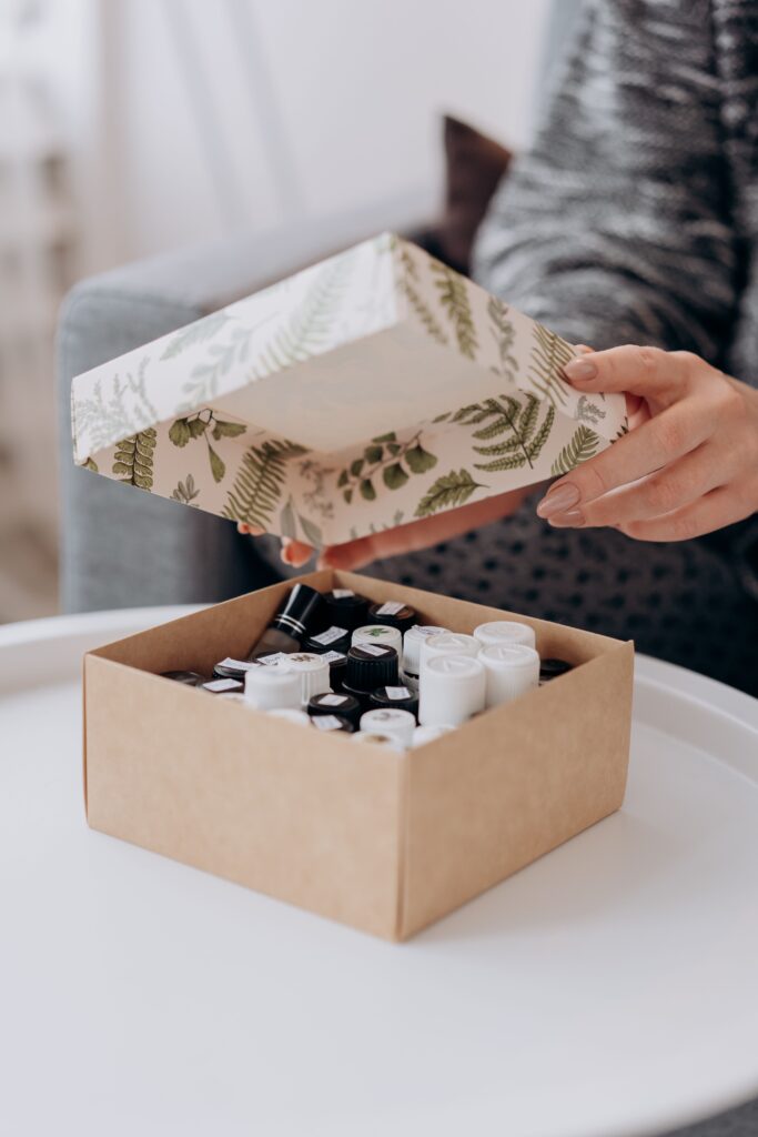 A person unboxing essential oils, promoting wellness and relaxation.